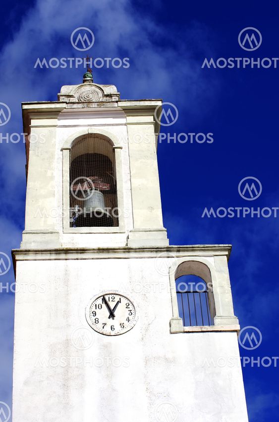 clock on white wall at Portuguese tower