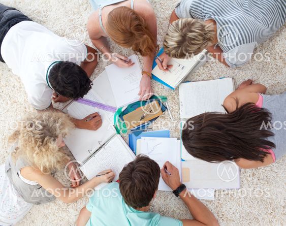 High angle of teenagers studying together