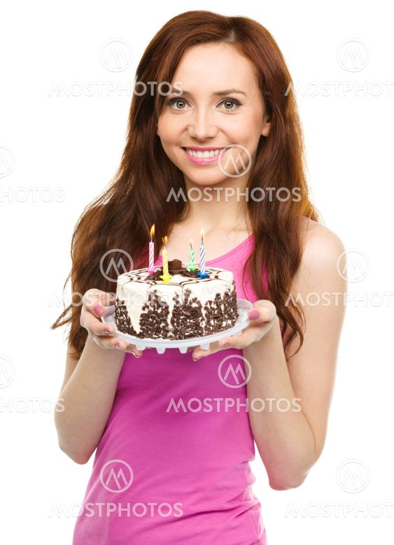 Young woman with anniversary cake