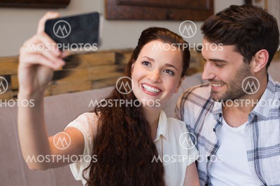 Cute couple on a date taking a selfie