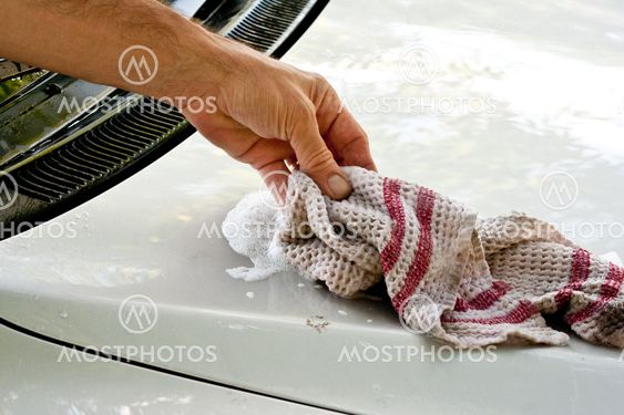 Hand washing a car.