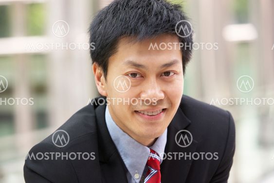 Portrait Of Chinese Businessman Outside Office