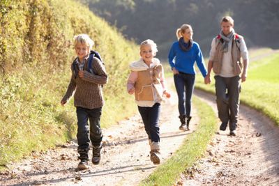 Young family walking in park
