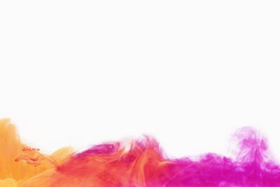 Stains of colorful acrylic ink in water.