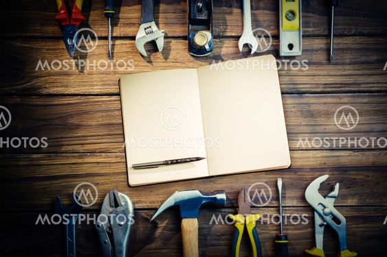 Composite image of notebook and pen