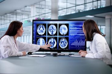 Brain surgeon analyzing MRI scans