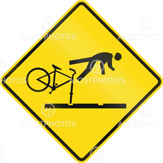 New Zealand road sign - Cyclists take care on rail tracks