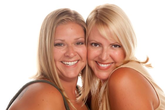 Two Beautiful Smiling Sisters Portrait