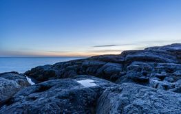 Rocks on coast during sunset