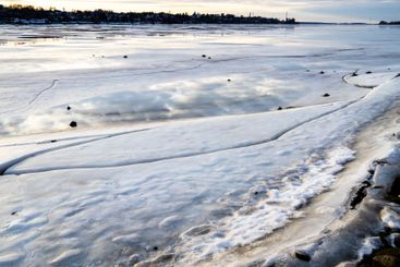 frozen river in Kostroma city in winter evening
