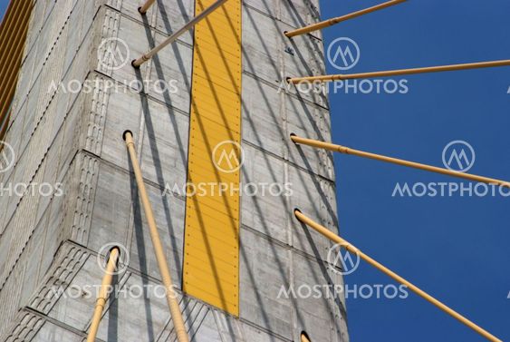Detail of bridge construction over blue sky
