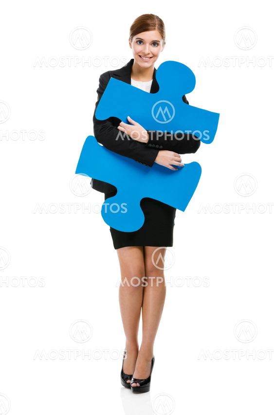 Businesswoman with a puzzle piece