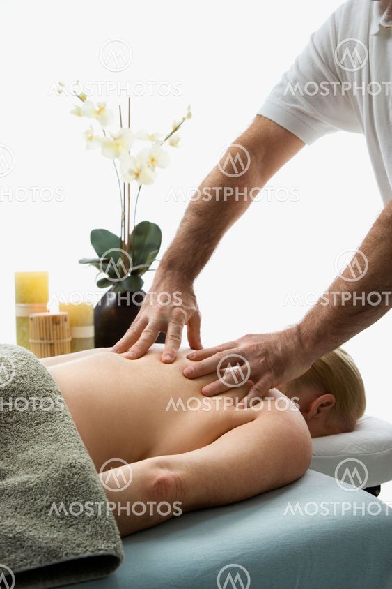 Man massaging woman.