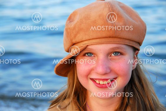 Smiling girl in a hat