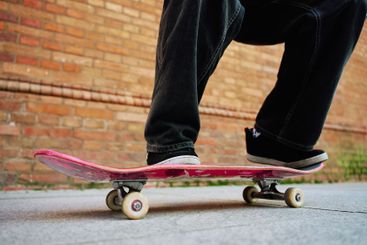 Skateboarder doing trick at urban street
