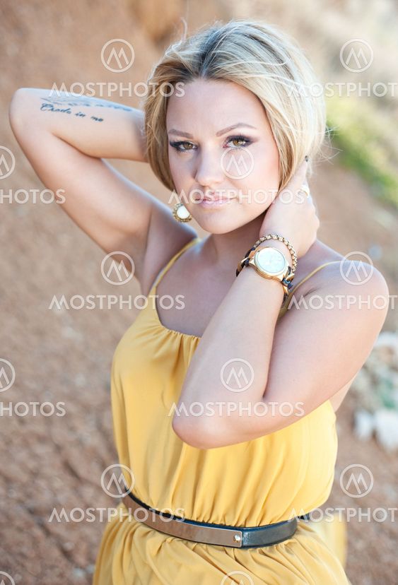 The beautiful young girl in a gold dress