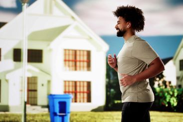 African athlete races through city streets, focused and...