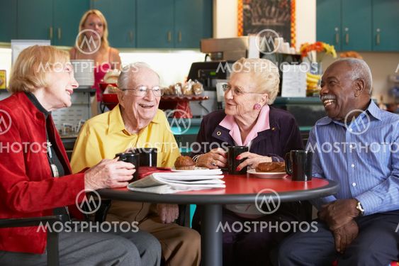 Senior adults having morning tea together