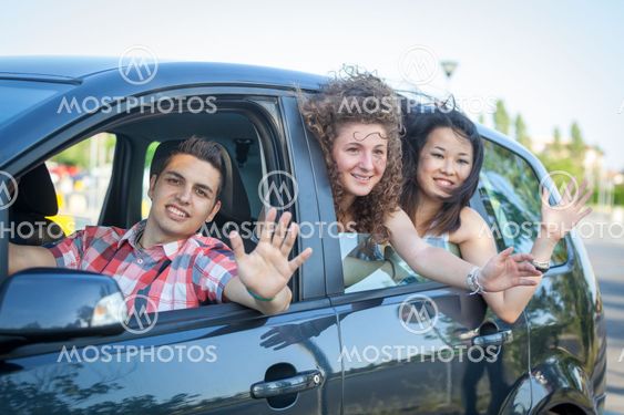 Boys and Girls in a Car Leaving for Vacation