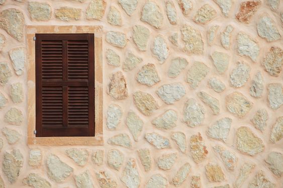 Window with closed wooden shutters