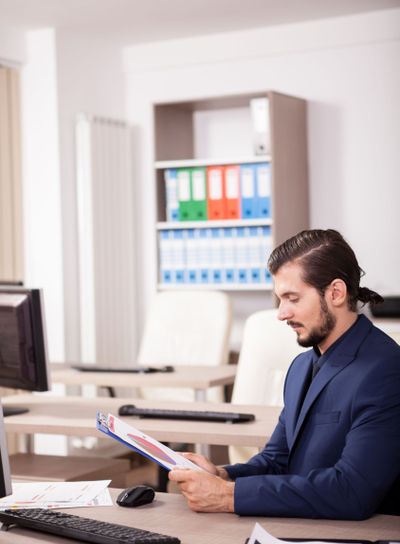 Portrait of Businessman in suit in his office