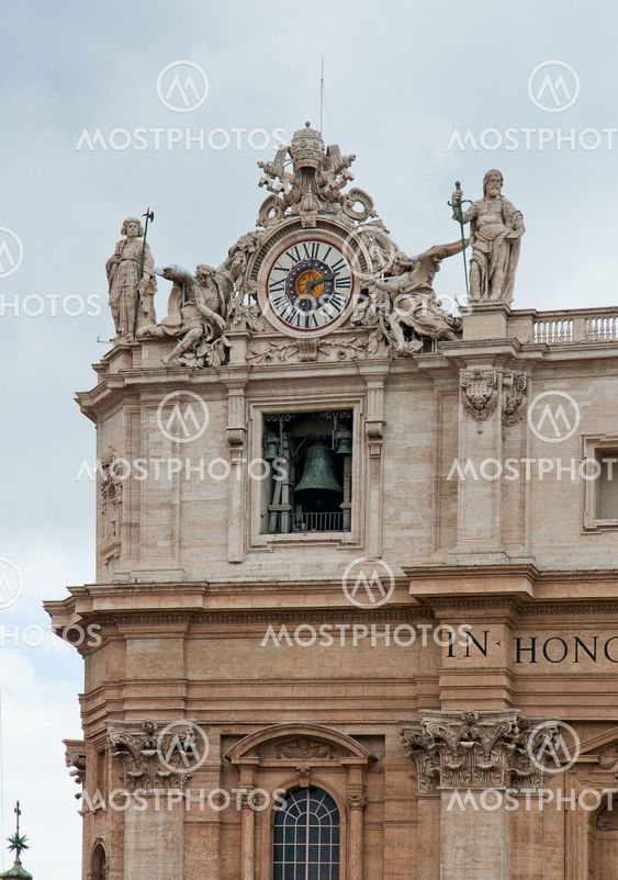 Сlock with bell on top corner of the St. Peter's basilica in Rome, italy