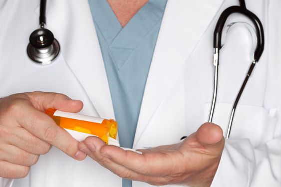 Male Doctor Abstract Pouring Out Pills