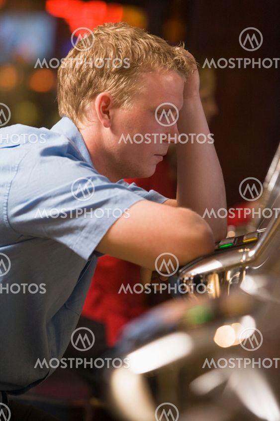 Man losing at slot machines