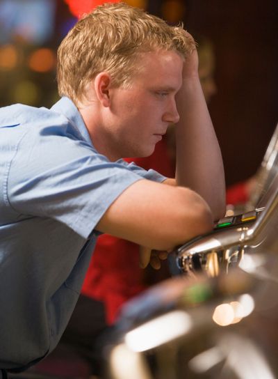 Man losing at slot machines