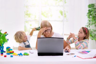 Mother working from home with kids. Quarantine.