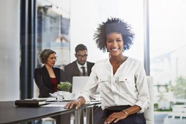 Businesswoman, portrait and smile in office for meeting,...