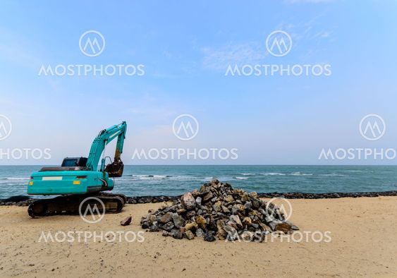 Excavator Machine Moves with Raised Bucket