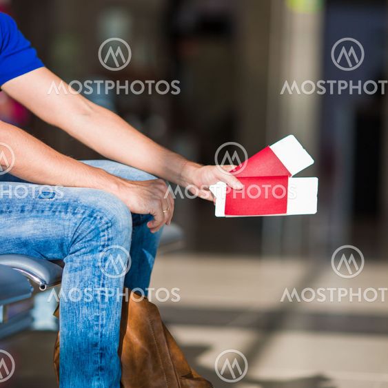 Closeup passports and boarding pass at airport indoor