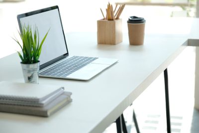 computer tablet pencil coffee cup on office desk....