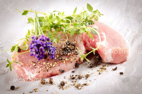 raw pork chops with herbs