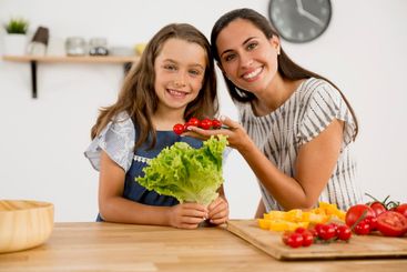 Mother and daughter cooking