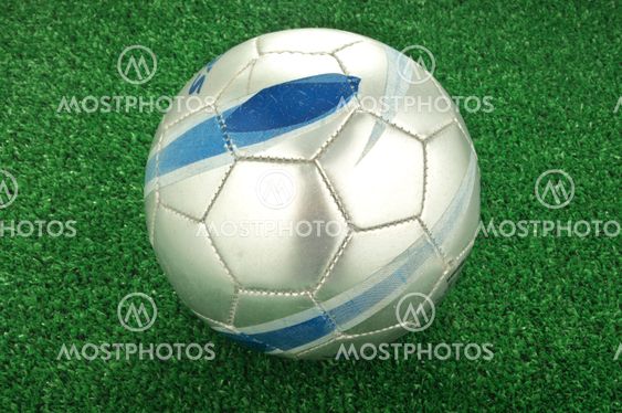 Soccer ball on green field