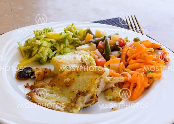 Fried fish fillet with vegetables