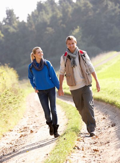 Young couple walking in park