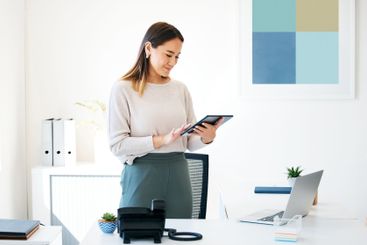Online, tablet and business woman in office for research...