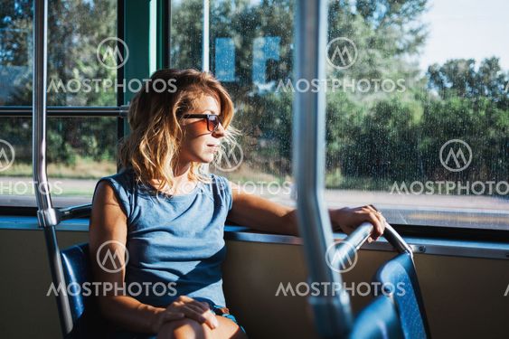 Young woman riding a public bus