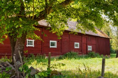 Red wooden barn on a farm in Sweden