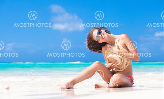 atrractive long haired woman relaxing at tropical beach
