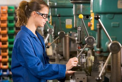 Machinist working on machine