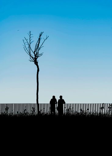 Romantic couple silhouette. Silhouettes of couple in...