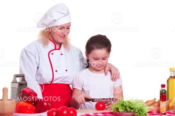 Mother and daughter cooking dinner