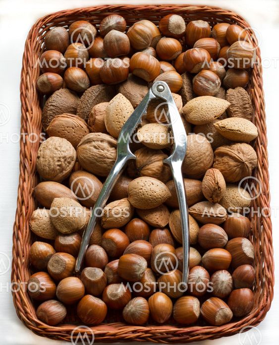 Mixed nuts in a baskets with nutcrackers