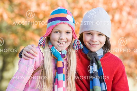 Children playing outdoors in autumn countryside