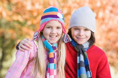 Children playing outdoors in autumn countryside