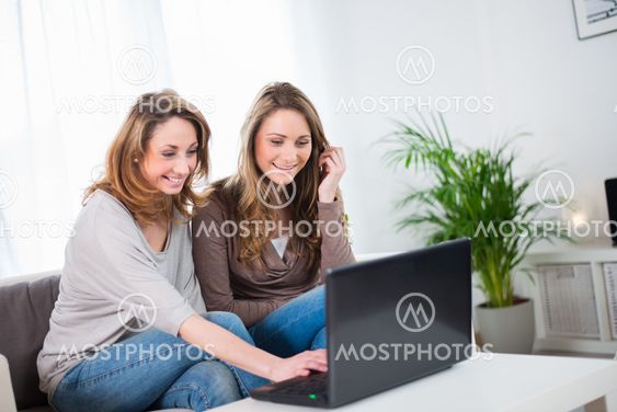 portrait of two beautiful girls at home